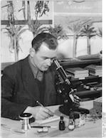 man using microscope